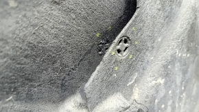 The rear left fender liner of a Volvo XC90 16-23 has torn fasteners.