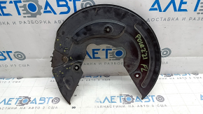 The front left brake disc cover for a Polestar 2 21-25 is dented and bent.