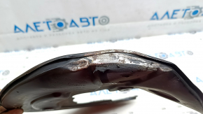 The front right brake disc cover for a Polestar 2 21-25 is dented and bent.
