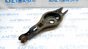 The lower control arm under the rear left spring of a Toyota Prius 50 Prime 16-22 is rusty, the silent block needs replacing