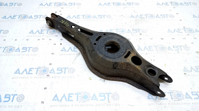 The lower control arm under the rear left spring of a Toyota Prius 50 Prime 16-22 is rusty, the silent block needs replacing