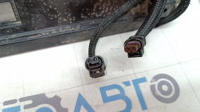 The foot-operated trunk opening sensor assembly for the Polestar 2 21-25 has broken fasteners.