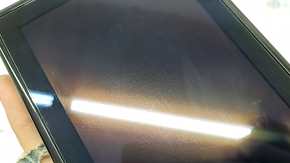 The Ford Explorer 2020-23 navigation display is worn and scratched.