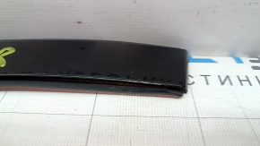 The front right roof lining for a Polestar 2 21-25 has worn paint.