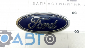 The Ford Explorer 20-23 tailgate emblem/badge has broken fasteners.
