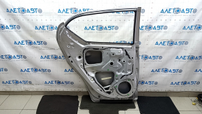 The door, bare rear left, Lexus CT200h 11-17 silver 1J4, is bent and dented.