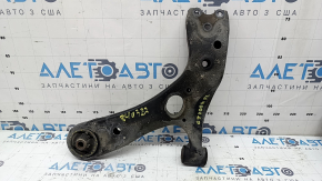 The lower front left control arm of a Lexus CT200h 11-17 has a torn silent block.