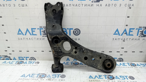The lower front left control arm of a Lexus CT200h 11-17 has a torn silent block.