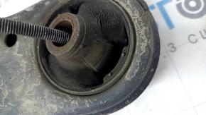 The lower front left control arm of a Lexus CT200h 11-17 has a torn silent block.