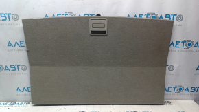 The trunk floor of a 12-17 Toyota Prius V beige, torn