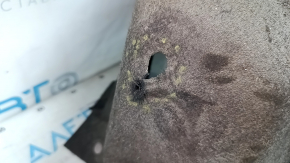 The rear left fender liner of a Lexus CT200h 11-17 has torn fasteners.