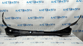 The plastic windshield wiper grille on a 19-22 Honda Insight is torn.