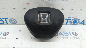 The Honda Insight 19-22 driver's steering wheel airbag is black and scratched.