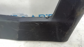 The lower rear left door trim of a Jeep Compass 17-24 is worn and scratched.
