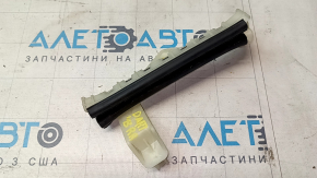 The rear right door glass guide on a 13-16 Dodge Dart has a broken mount.