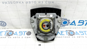 The driver's steering wheel airbag for a Toyota Prius 30 10-15 is black and scratched.