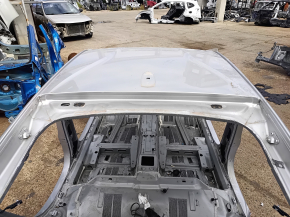 Metal roof of a Chevrolet Volt 16-on-body, dented