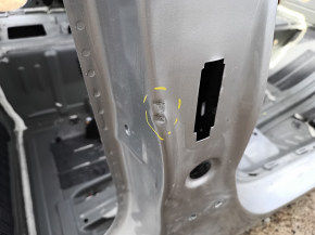 The right central body pillar of a Chevrolet Volt 16 is dented on the body.
