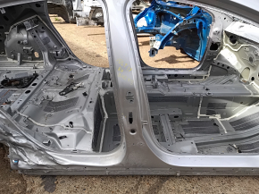 The right central body pillar of a Chevrolet Volt 16 is dented on the body.