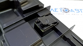 The Audi A4 B9 17 trunk tool tray has a broken mount and scratches.
