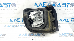Right headlight for a 1995 Jeep Renegade (pre-restored) with graphite frame and scratches.