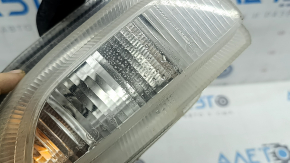 Front right turn signal with DRL for a 2015-2018 Jeep Renegade, fogged up, cracks in the mounts, cracks