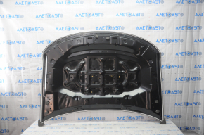 The hood of a Ford Explorer 20-23 is bare, aluminum, made in China, and has a dented corner.