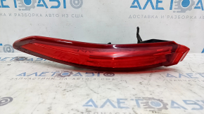 The outer left fender light of a Toyota Venza 21-24 is worn out.