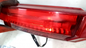 The outer left fender light of a Toyota Venza 21-24 is worn out.