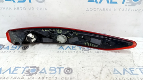 The right outer fender light of a Toyota Venza 21-24 has broken fasteners.