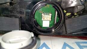 The right outer fender light of a Toyota Venza 21-24 has broken fasteners.