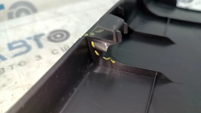 The lower left center pillar trim for a 2021 Toyota Venza is black, the plastic has turned white.