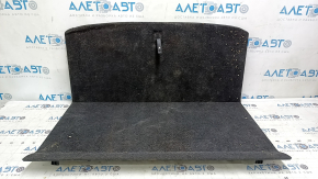 The trunk floor of a 2018 Toyota Venza, black Limited, XLE, needs dry cleaning. The handle is defective, it is worn, dented, and torn.