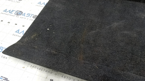 The trunk floor of a 2018 Toyota Venza, black Limited, XLE, needs dry cleaning. The handle is defective, it is worn, dented, and torn.
