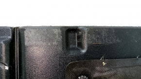 The trunk floor of a 2018 Toyota Venza, black Limited, XLE, needs dry cleaning. The handle is defective, it is worn, dented, and torn.