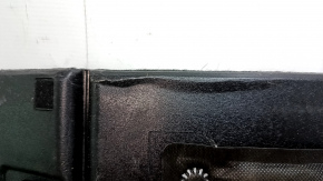 The trunk floor of a 2018 Toyota Venza, black Limited, XLE, needs dry cleaning. The handle is defective, it is worn, dented, and torn.