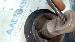 The rear right longitudinal control arm of a Toyota Venza 21-24 AWD has a cracked silent block.