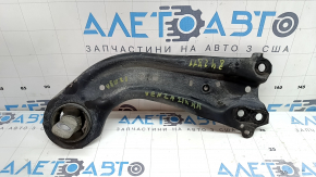 The rear right longitudinal control arm of a Toyota Venza 21-24 AWD has a cracked silent block.