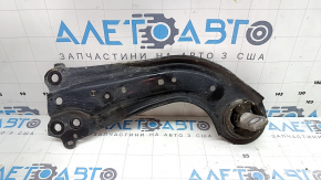The rear right longitudinal control arm of a Toyota Venza 21-24 AWD has a cracked silent block.