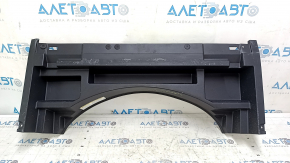 The trunk tray of a Toyota Venza 21-24 is black, scratched, dented, and the plastic has turned white.