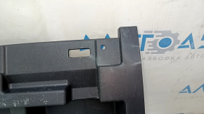 The trunk tray of a Toyota Venza 21-24 is black, scratched, dented, and the plastic has turned white.