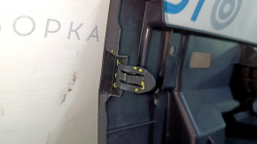 The trunk tray of a Toyota Venza 21-24 is black, scratched, dented, and the plastic has turned white.