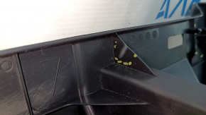 The trunk tray of a Toyota Venza 21-24 is black, scratched, dented, and the plastic has turned white.