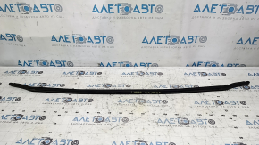 The hood seal on the bumper of a Toyota Venza 21-24 is torn.