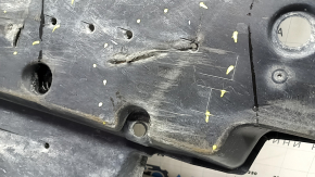 The front left underbody protection of Toyota Venza 21-24 is broken, scuffed, and dented.