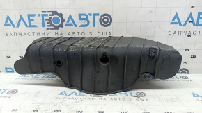 The lower control arm lining under the rear left spring of the Audi Q5 80A 18-24 is worn and has tears.