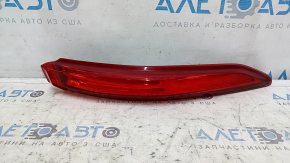 The right outer fender light of a Toyota Venza 21-24 has broken fasteners.