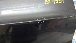 The trunk door is bare, the lower part of the BMW X5 F15 14-18 graphite A90, there are nicks, scratches, and a dent.