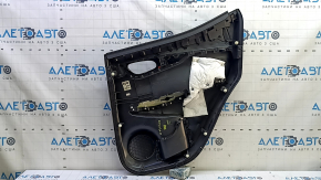 Rear left door panel for a 2022 Nissan Rogue Sport, black with black leather insert, black leather armrest, gray molding