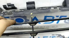 The upper grille of the front bumper of the BMW X5 F15 14-18 has broken honeycombs.